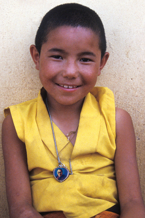 Young Nun with dalailama pendant - Photo by Kiran Ambwani