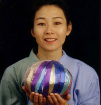 Picture of Noriko Yamamoto holding a ball of ribbon